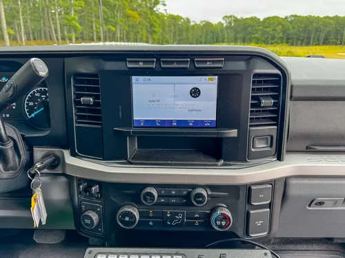 Rear-to-front cabin view showing back seats, center console, and front seats.